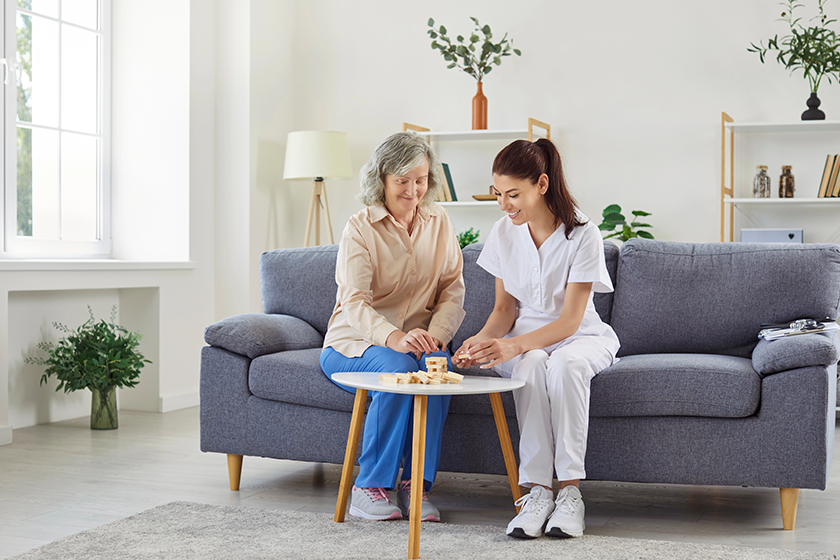 Young smiling nurse woman playing