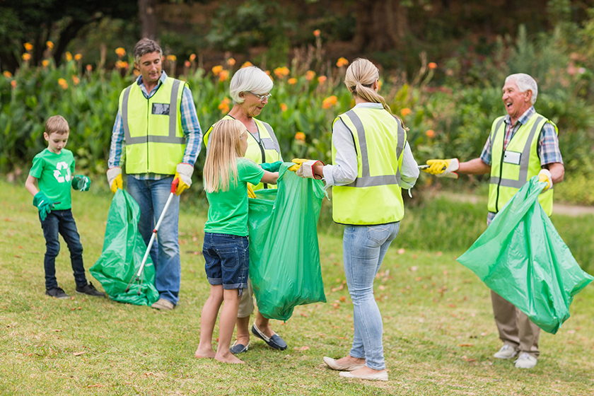 Happy family collecting rubbish